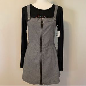 Women’s black/white checkered overall mini dress.